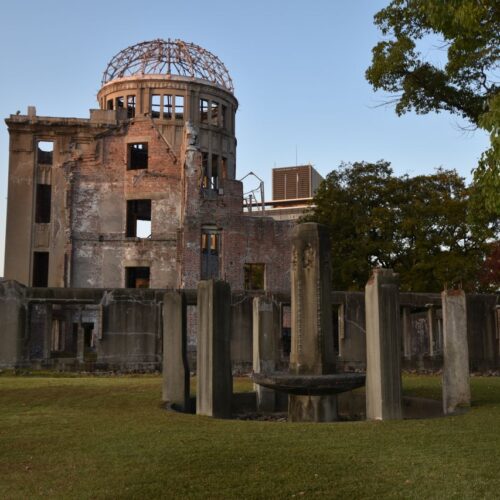 Historic Hiroshima Peace Memorial Dome in Japan at sunset, showcasing urban heritage.