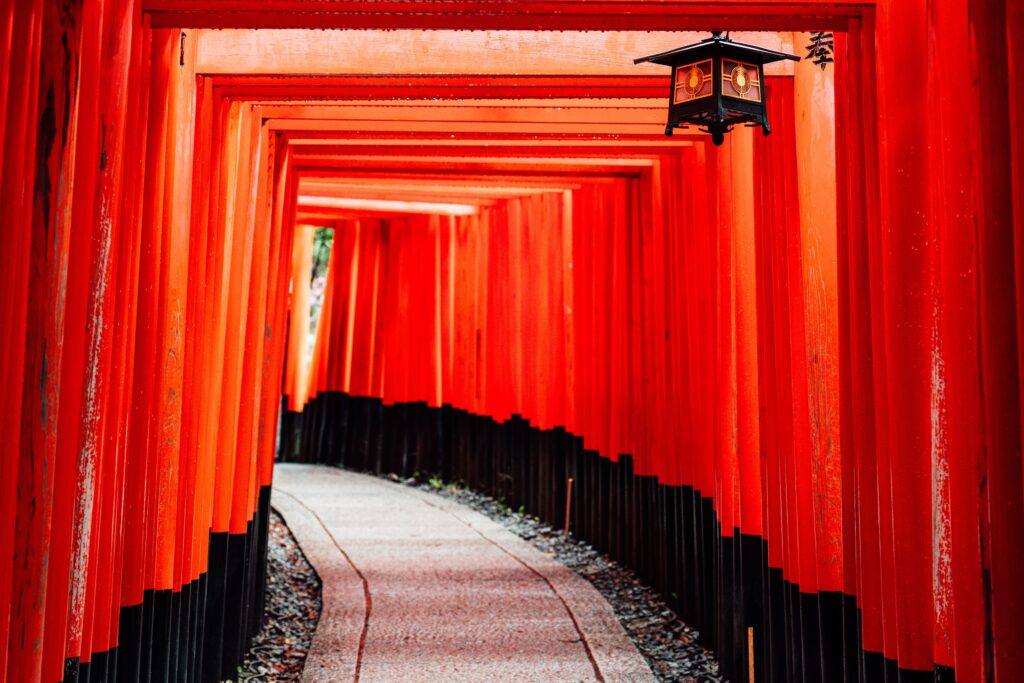 Trip Search Result Explore the iconic red torii gates of Fushimi Inari Shrine in Kyoto, Japan, featuring traditional architecture.