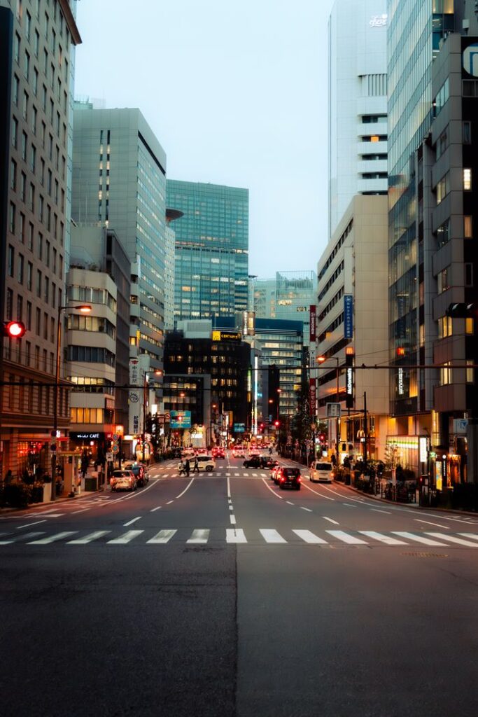 Trip Search Result Bustling Tokyo street at dusk showcasing modern architecture and city life.