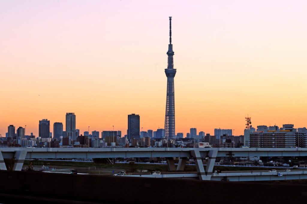 Trip Search Result A stunning view of Tokyo Skytree at sunset, towering over the urban skyline.