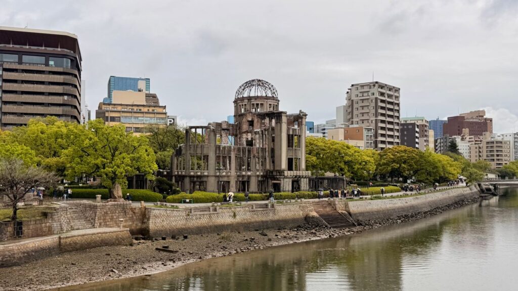 Trip Search Result The iconic Hiroshima Peace Memorial stands resiliently along the river in Hiroshima, Japan.