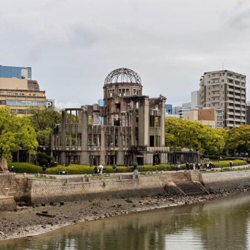 The iconic Hiroshima Peace Memorial stands resiliently along the river in Hiroshima, Japan.