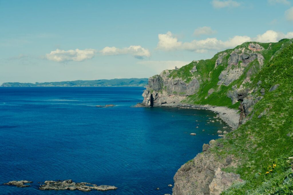 Trip Search Result Stunning view of rocky cliffs and blue ocean in Hokkaido, Japan.